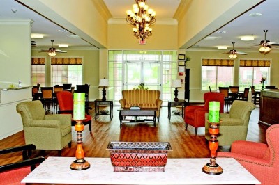 Common area with a love seat and four chairs