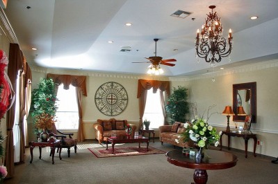 Common area with large windows, seating area and tables