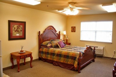 Bedroom with small bed and two side tables