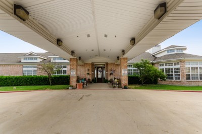 Building entrance driveway with awning 