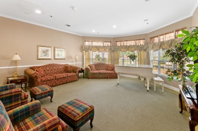 common area with seating and piano