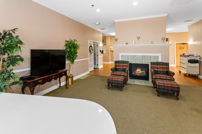 Common area with seating next to fireplace