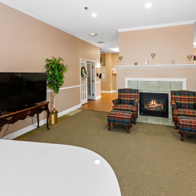 Common area with seating next to fireplace